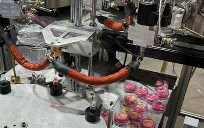 Hot pour machine in use making cosmetics